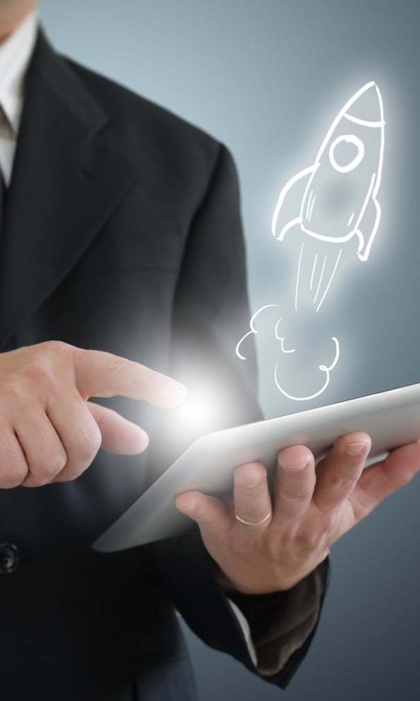 Professional with tablet showing rocket innovation concept